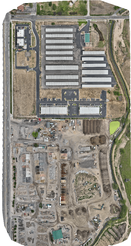 Construction site aerial view with drone pilot tracking